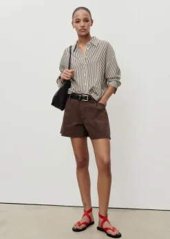 Denim shorts with frayed hem and pl